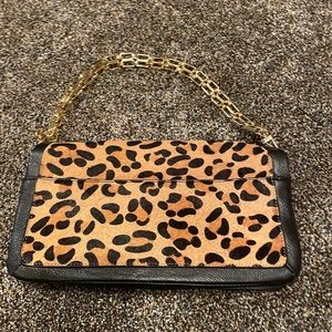 Faux leopard animal fur with black leather